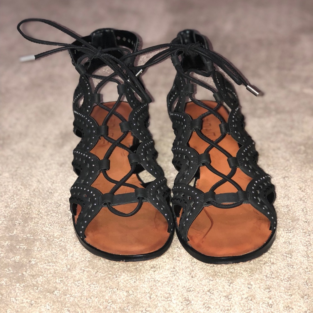 Black heeled gladiator-style shoes